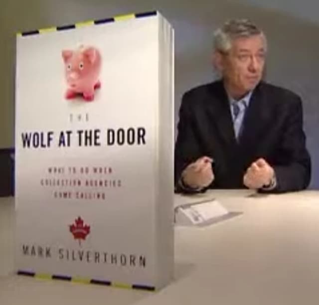 Mark Silverthorn appearing on TV with his book The Wolf At The Door